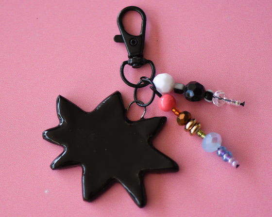 Starburst bag charm 25